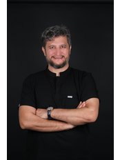 Mr Alkan Demirkan, Dentist — Over the Moon Smile