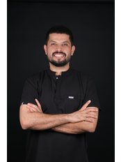 Mr Baris Kipritoglu, Oral Surgeon — Over the Moon Smile